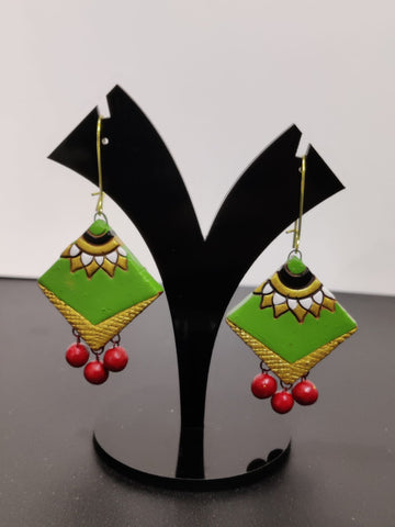 Terracotta Fusion: Vibrant Green and Red Earrings on Black Stand
